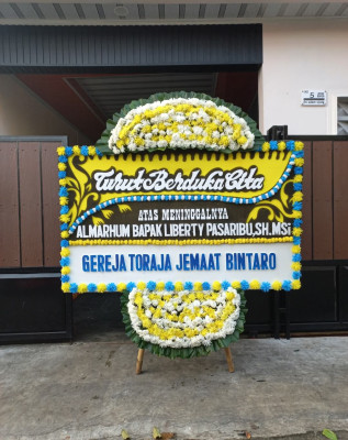 Papan Bunga Duka di Blado